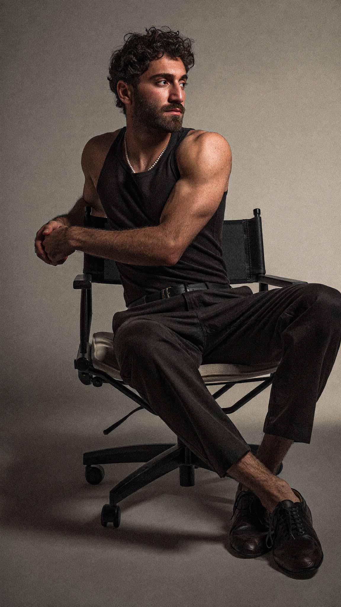 Noam Agassi sitting on a director's chair